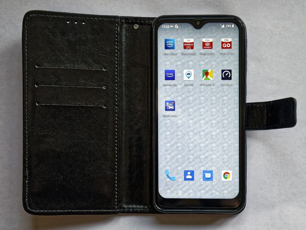 A smartphone in hand showing a wallet app