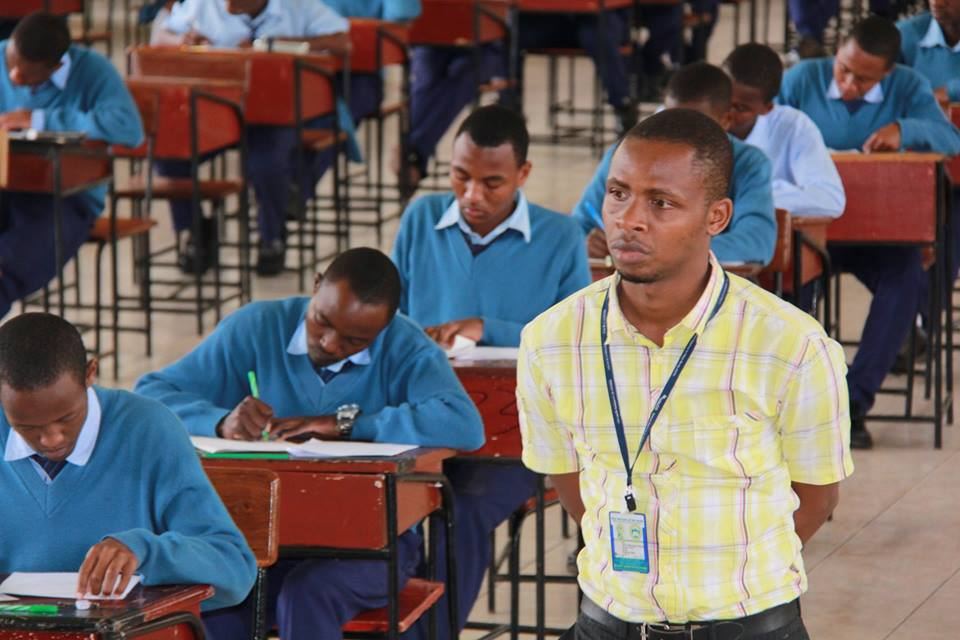 Students checking their board exam results on a mobile phone