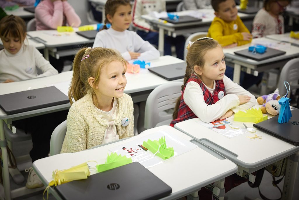 Students in a classroom studying without smartphones on their desks